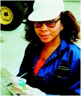 A microbiologist examines a core sample from a bioremediation demonstration. (U.S. EPA. Reproduced by permission.)