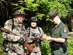 ECO checking hunting licenses