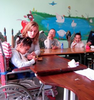 Female volunteer working with special needs children in Morocco