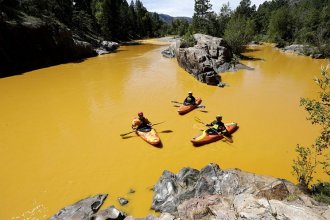 Kayakers in the Animas River at Durango, Colorado, just after the 2015 Gold King Mine discharge.