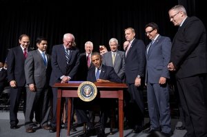 President Barack Obama signs H.R. 3230, the Veterans' Access, Choice, and Accountability Act of 2014, at Fort Belvoir, Va., Aug. 7, 2014. The bill provides the Department of Veterans Affairs the resources to improve access and quality of care for veterans. (Official White House Photo by Pete Souza)