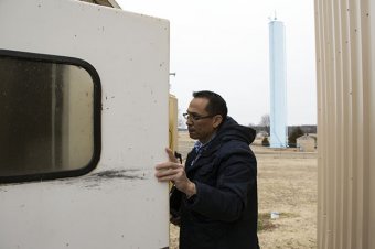 Vance Pennington, a regional manager for the Oklahoma Department of Environmental Quality, inspects a chlorine treatment system at a water treatment plant in Chandler, Okla.